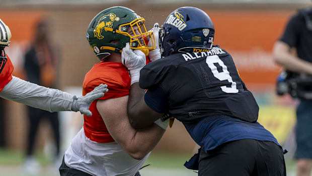 National team offensive lineman Grey Zabel of North Dakota State works against National team defensive lineman Darius Alexand