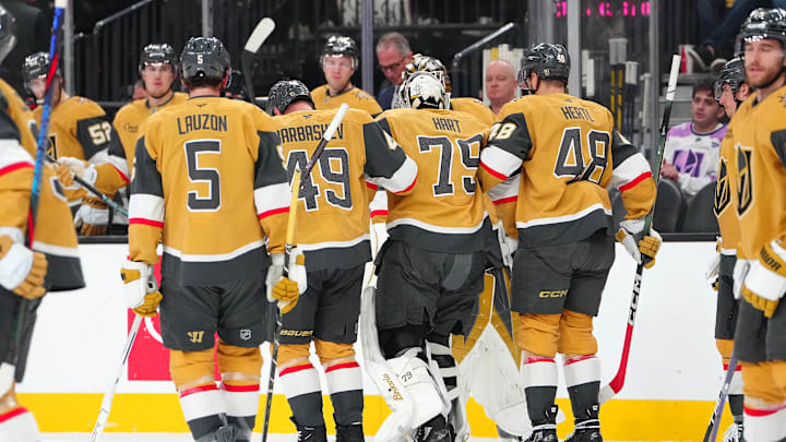 Jan 8, 2026; Las Vegas, Nevada, USA; Vegas Golden Knights goaltender Carter Hart (79) is helped off the ice by left wing Ivan Barbashev (49) and center Tomas Hertl (48) after sustaining an injury against the Columbus Blue Jackets during the first period at T-Mobile Arena. Mandatory Credit: Stephen R. Sylvanie-Imagn Images
