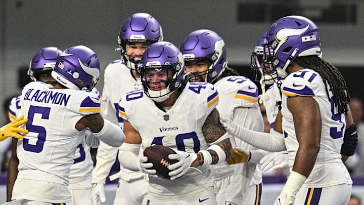 Dec 24, 2023; Minneapolis, Minnesota, USA; Minnesota Vikings linebacker Ivan Pace Jr. (40) and cornerback Mekhi Blackmon (5) react with teammates after a fumble recovery against the Detroit Lions during the game at U.S. Bank Stadium. Mandatory Credit: Jeffrey Becker-Imagn Images