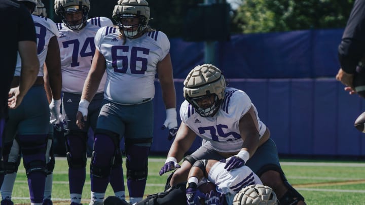 Drew Azzoparid (74), Landen Hatchett and D'Angalo Titialii (75) are UW offensive-line candidates. 