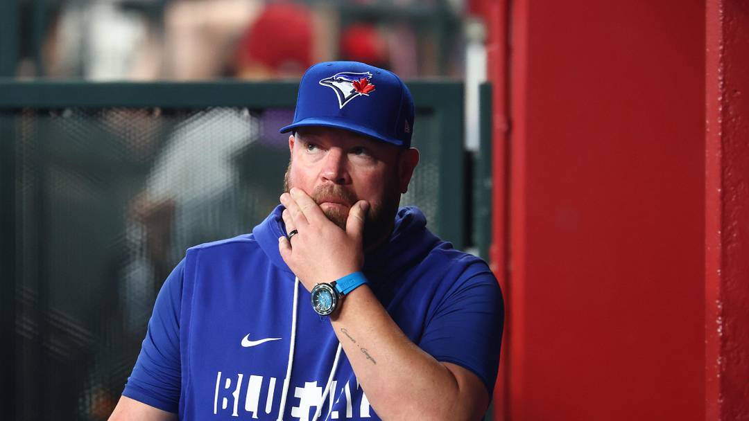 Toronto Blue Jays manager John Schneider in the dugout. 