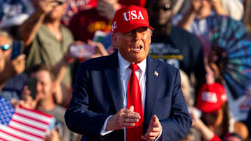President Donald Trump takes the stage during the American 250 kickoff event on July 3, 2025, at the Iowa State Fairgrouds.