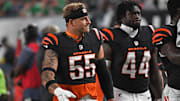 Cincinnati Bengals linebackers Logan Wilson and Demetrius Knight Jr. walk off the field at halftime against the Eagles.