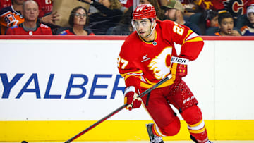 Nov 3, 2024; Calgary, Alberta, CAN; Calgary Flames right wing Matt Coronato (27) skates with the puck against the Edmonton Oilers during the second period at Scotiabank Saddledome. Mandatory Credit: Sergei Belski-Imagn Images