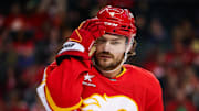 Mar 14, 2025; Calgary, Alberta, CAN; Calgary Flames defenseman Rasmus Andersson (4) reacts during the third period against the Colorado Avalanche at Scotiabank Saddledome. Mandatory Credit: Sergei Belski-Imagn Images