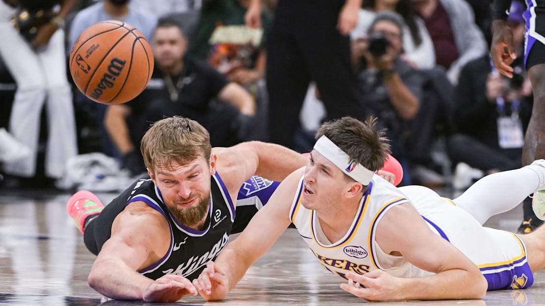 Oct 26, 2025; Sacramento, California, USA; Sacramento Kings forward/center Domantas Sabonis (11) and Los Angeles Lakers guard Austin Reaves (15) fight for possession of the ball during the fourth quarter at Golden 1 Center. Mandatory Credit: Ed Szczepanski-Imagn Images Oct 26, 2025; Sacramento, California, USA; Sacramento Kings forward/center Domantas Sabonis (11) and Los Angeles Lakers guard Austin Reaves (15) fight for possession of the ball during the fourth quarter at Golden 1 Center. Mandatory Credit: Ed Szczepanski-Imagn Images