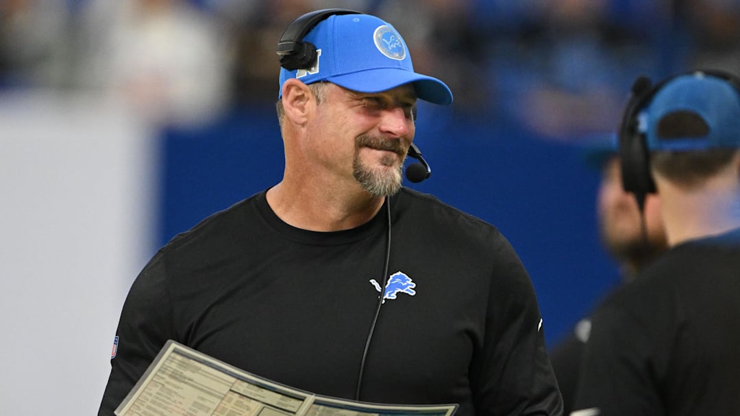 Nov 24, 2024; Indianapolis, Indiana, USA; Detroit Lions head football coach Dan Campbell smiles on the sidelines before the game against the Indianapolis Colts  at Lucas Oil Stadium. Mandatory Credit: Marc Lebryk-Imagn Images