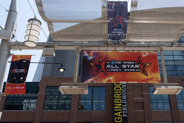 Signs advertising the WNBA All-Star games go up around Gainbridge Fieldhouse