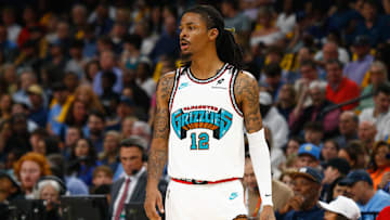 Apr 18, 2025; Memphis, Tennessee, USA; Memphis Grizzlies guard Ja Morant (12) looks on during the second quarter against the Dallas Mavericks at FedExForum. Mandatory Credit: Petre Thomas-Imagn Images