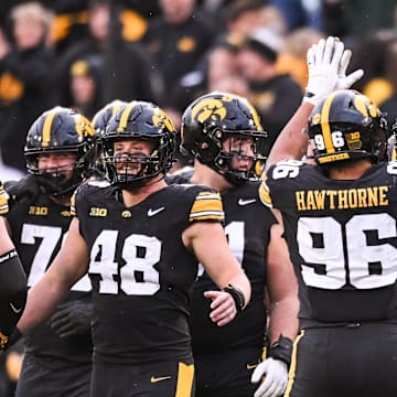 Oct 25, 2025; Iowa City, Iowa, USA; Iowa Hawkeyes defensive lineman Aaron Graves (95) reacts with teammates during the fourth quarter against the Minnesota Golden Gophers at Kinnick Stadium. Mandatory Credit: Jeffrey Becker-Imagn Images