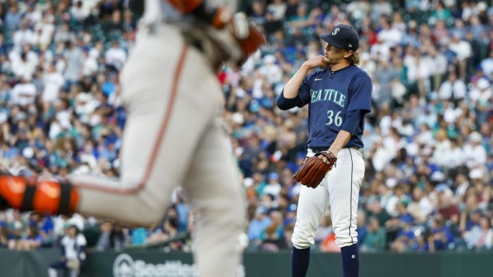 Seattle Mariners starting pitcher Logan Gilbert (36) stands on the mound after surrendering a solo-home run to Baltimore Orioles first baseman Ryan O'Hearn (foreground) on Wednesday at T-Mobile Park.