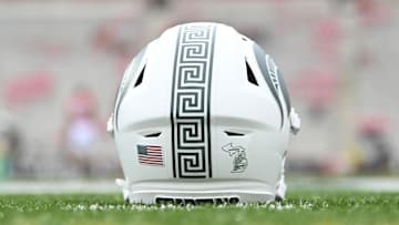 Sep 7, 2024; College Park, Maryland, USA; A detailed view of Michigan State Spartans helmet on the field before the game against the Maryland Terrapins at SECU Stadium. Mandatory Credit: Tommy Gilligan-Imagn Images