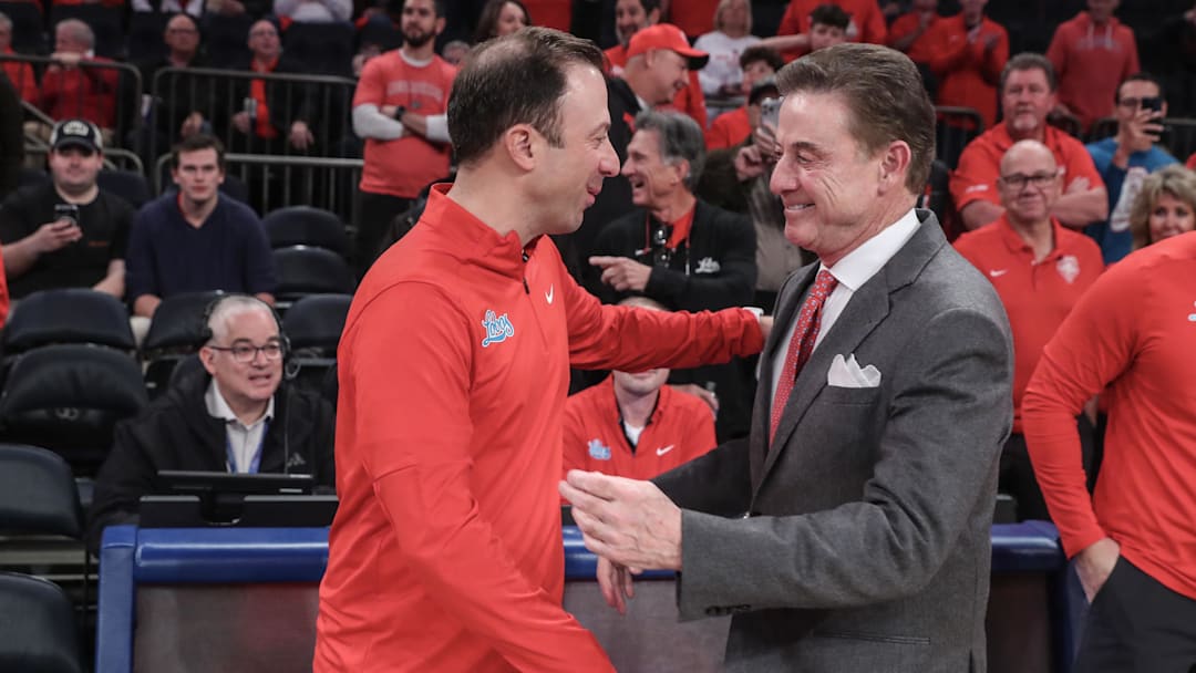 Nov 17, 2024; New York, New York, USA; New Mexico Lobos head coach Richard Pitino and St. John's Red Storm head coach Rick Pitino greet each other prior to the start of the game at Madison Square Garden. Mandatory Credit: Wendell Cruz-Imagn Images