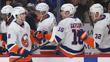 Mar 18, 2025; Pittsburgh, Pennsylvania, USA;  New York Islanders defenseman Noah Dobson (8) celebrates his goal with the Islanders bench against the Pittsburgh Penguins during the third period at PPG Paints Arena. Mandatory Credit: Charles LeClaire-Imagn Images
