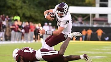 Oct 19, 2024; Starkville, Mississippi, USA;  Texas A&M Aggies quarterback Conner Weigman (15) runs the ball against Mississippi State Bulldogs cornerback Brice Pollock (14) during the third quarter at Davis Wade Stadium at Scott Field. Mandatory Credit: Matt Bush-Imagn Images