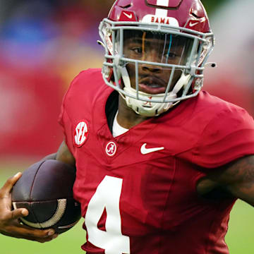 Sep 2, 2023; Tuscaloosa, Alabama, USA; Alabama Crimson Tide quarterback Jalen Milroe (4) carries the ball against the Middle Tennessee Blue Raiders for a touchdown during the first quarter at Bryant-Denny Stadium. Mandatory Credit: John David Mercer-Imagn Images