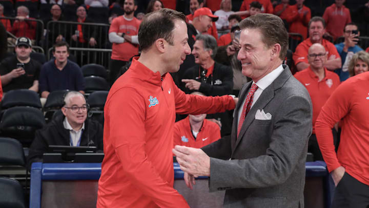 Nov 17, 2024; New York, New York, USA; New Mexico Lobos head coach Richard Pitino and St. John's Red Storm head coach Rick Pitino greet each other prior to the start of the game at Madison Square Garden. Mandatory Credit: Wendell Cruz-Imagn Images