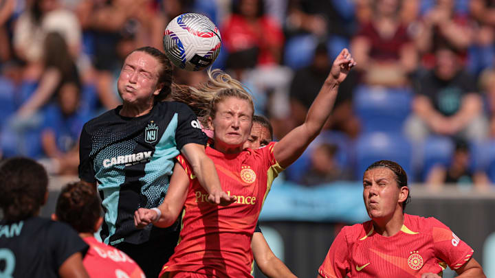 Gotham FC midfielder Emily Sonnett (6) battle for the ball against Portland Thorns FC forward Alexa Spaanstra (77) during the second half at Red Bull Arena. Gotham FC midfielder Emily Sonnett (6) battle for the ball against Portland Thorns FC forward Alexa Spaanstra (77) during the second half at Red Bull Arena.