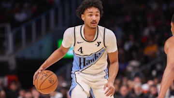 Atlanta Hawks guard Kobe Bufkin (4) dribbles against the Dallas Mavericks in the fourth quarter at State Farm Arena. Mandatory Credit: Brett Davis-Imagn Images