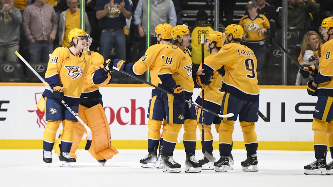 Apr 16, 2025; Nashville, Tennessee, USA;  Nashville Predators celebrate the win against the Dallas Stars during the third period at Bridgestone Arena. Mandatory Credit: Steve Roberts-Imagn Images