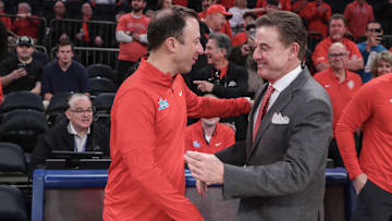 New Mexico Lobos head coach Richard Pitino (left) is a hot coaching commodity, just like his dad, St. John's head coach Rick Pitino (right).