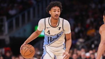 Nov 25, 2024; Atlanta, Georgia, USA; Atlanta Hawks guard Kobe Bufkin (4) dribbles against the Dallas Mavericks in the fourth quarter at State Farm Arena. Mandatory Credit: Brett Davis-Imagn Images
