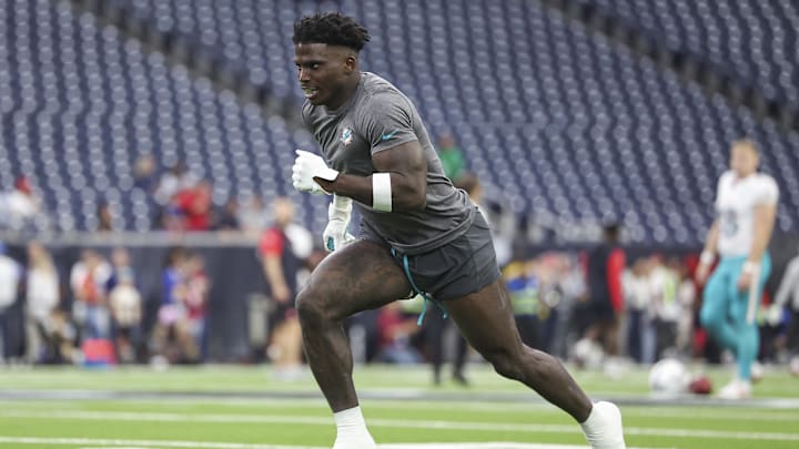 Miami Dolphins wide receiver Tyreek Hill warms up before the game against the Houston Texans.