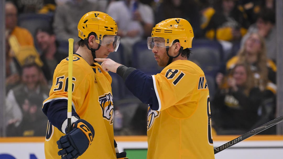 Mar 5, 2026; Nashville, Tennessee, USA;  Nashville Predators left wing Erik Haula (56) and center Jonathan Marchessault (81) talk just before the face off against the Boston Bruins during the third period at Bridgestone Arena. Mandatory Credit: Steve Roberts-Imagn Images