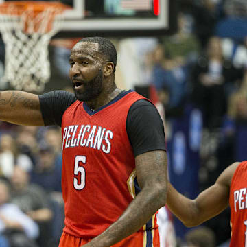 Apr 13, 2016; Minneapolis, MN, USA; New Orleans Pelicans center Kendrick Perkins (5) high fives New Orleans Pelicans guard Tim Frazier (2) after making a buzzer beater shot at the end of third quarter against the Minnesota Timberwolves at Target Center. The Timberwolves won 144-109. Mandatory Credit: Jesse Johnson-Imagn Images