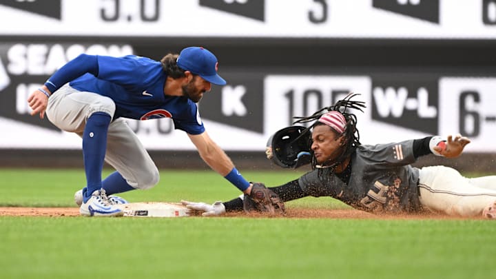 Aug 31, 2024; Washington, District of Columbia, USA; Washington Nationals shortstop CJ Abrams (5) is thrown out at second base by Chicago Cubs shortstop Dansby Swanson (7) during the sixth inning at Nationals Park.