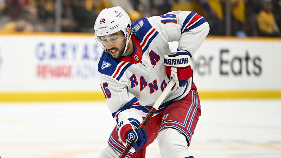 Dec 21, 2025; Nashville, Tennessee, USA;  New York Rangers center Vincent Trocheck (16) skates with the puck against the Nashville Predators during the second period at Bridgestone Arena. Mandatory Credit: Steve Roberts-Imagn Images