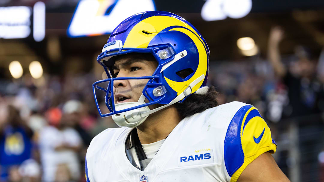 Dec 7, 2025; Glendale, Arizona, USA; Los Angeles Rams wide receiver Puka Nacua (12) reacts after scoring a touchdown against the Arizona Cardinals at State Farm Stadium. Mandatory Credit: Mark J. Rebilas-Imagn Images