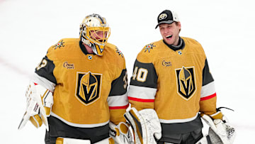 Apr 20, 2025; Las Vegas, Nevada, USA; Vegas Golden Knights goaltender Adin Hill (33) celebrates with goaltender Akira Schmid (40) after they defeated the Minnesota Wild 4-2 in game one of the first round of the 2025 Stanley Cup Playoffs at T-Mobile Arena. Mandatory Credit: Stephen R. Sylvanie-Imagn Images