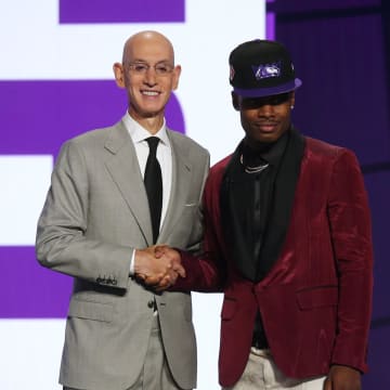 Jul 29, 2021; Brooklyn, New York, USA; Davion Mitchell (Baylor) poses with NBA commissioner Adam Silver after being selected as the number nine overall pick by the Sacramento Kings in the first round of the 2021 NBA Draft at Barclays Center. Mandatory Credit: Brad Penner-USA TODAY Sports