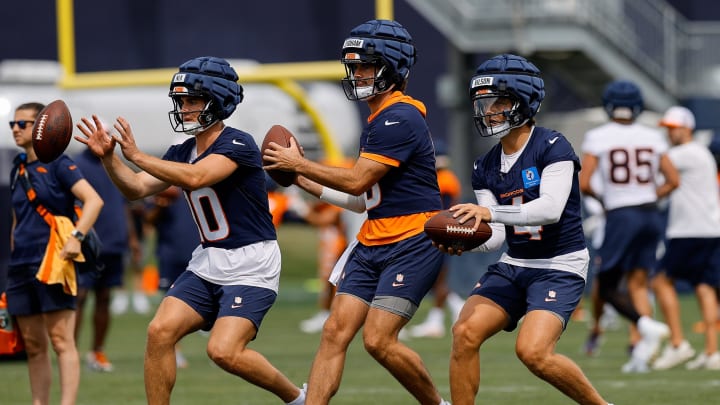 Jul 26, 2024; Englewood, CO, USA; Denver Broncos quarterback Bo Nix (10) and quarterback Jarrett Stidham (8) and quarterback Zach Wilson (4) during training camp at Broncos Park Powered by CommonSpirit.