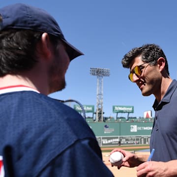 May 13, 2023; Boston, Massachusetts, USA; Boston Red Sox chief baseball officer Chaim Bloom signs an autograph prior to a game against the against the St. Louis Cardinals at Fenway Park. Mandatory Credit: Bob DeChiara-Imagn Images