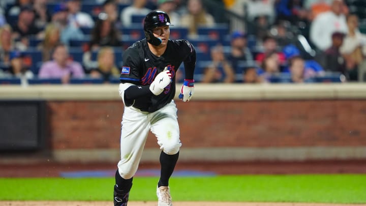 New York Mets left fielder Brandon Nimmo (9) runs out a single against the San Diego Padres during the third inning at Citi Field.