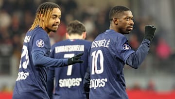 Ousmane Dembélé celebrating one of his three goals against Brest with Barcola and Kvaratskhelia.