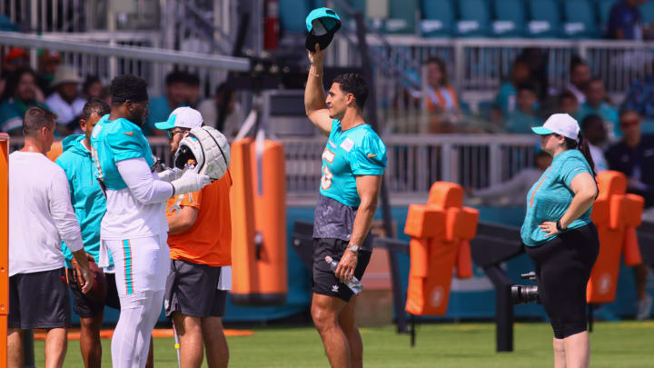 Miami Dolphins linebacker Jaelan Phillips (15) reacts with fans during training camp at Baptist Health Training Complex.