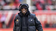 Nov 25, 2023; Salt Lake City, Utah, USA; Colorado Buffaloes head coach Deion 'Coach Prime' Sanders on the field against the Utah Utes at Rice-Eccles Stadium. Mandatory Credit: Christopher Creveling-Imagn Images