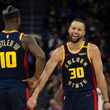 Mar 13, 2025; San Francisco, California, USA; Golden State Warriors forward Jimmy Butler III (10) and guard Stephen Curry (30) share a laugh during the second quarter against the Sacramento Kings at Chase Center. Mandatory Credit: D. Ross Cameron-Imagn Images