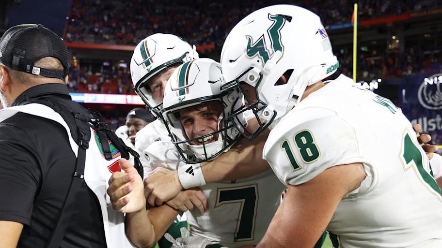 South Florida placekicker Nico Gramatica is congratulated after he made the game-winning field goal against Florida.