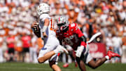 Ohio State Buckeyes defensive end Kenyatta Jackson Jr. (97) chases Texas Longhorns quarterback Arch Manning (16) during the NCAA football game at Ohio Stadium on Aug. 30, 2025.
