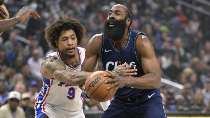 Mar 24, 2024; Los Angeles, California, USA;  Los Angeles Clippers guard James Harden (1) is fouled by Philadelphia 76ers guard Kelly Oubre Jr. (9) as he drives to the basket in the first half at Crypto.com Arena. Mandatory Credit: Jayne Kamin-Oncea-USA TODAY Sports