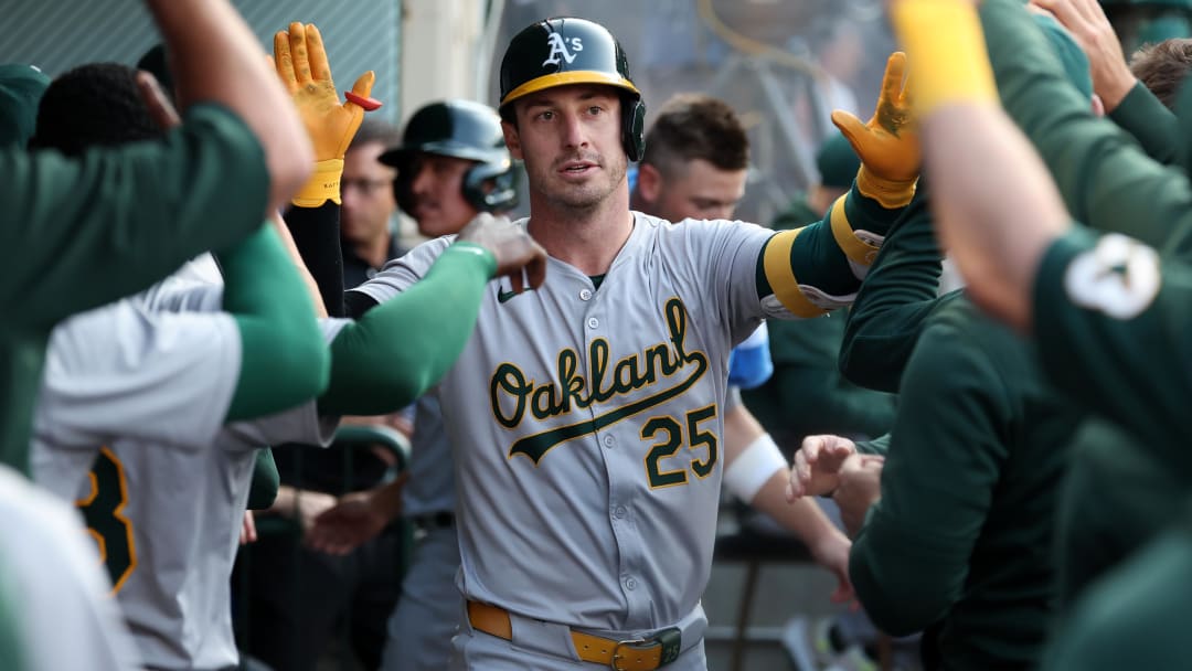 Jul 25, 2024; Anaheim, California, USA;  Oakland Athletics designated hitter Brent Rooker (25) is greeted by teammates in the dugout after hitting a home run during the first inning against the Los Angeles Angels at Angel Stadium. Mandatory Credit: Kiyoshi Mio-USA TODAY Sports