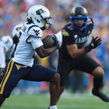 West Virginia Mountaineers wide receiver Oran Singleton Jr. (3) runs the ball during the first half of the game against Kansas Jayhawks at David Booth Kansas Memorial Stadium on Sept. 20, 2025.