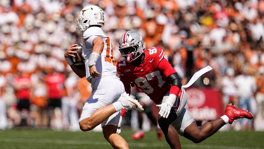 Ohio State Buckeyes defensive end Kenyatta Jackson Jr. (97) chases Texas Longhorns quarterback Arch Manning (16) during the NCAA football game at Ohio Stadium on Aug. 30, 2025. Ohio State Buckeyes defensive end Kenyatta Jackson Jr. (97) chases Texas Longhorns quarterback Arch Manning (16) during the NCAA football game at Ohio Stadium on Aug. 30, 2025.