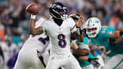 Oct 30, 2025; Miami Gardens, Florida, USA; Baltimore Ravens quarterback Lamar Jackson (8) throws downfield during the second quarter against the Miami Dolphins at Hard Rock Stadium. Mandatory Credit: Sam Navarro-Imagn Images