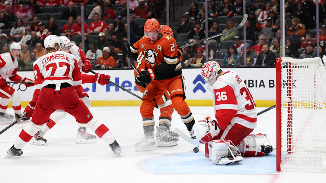 Oct 31, 2025; Anaheim, California, USA;  Detroit Red Wings goaltender John Gibson (36) blocks a shot by Anaheim Ducks defenseman Jackson Lacombe (2) during the second period at Honda Center. Mandatory Credit: Kiyoshi Mio-Imagn Images