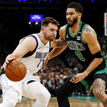 Jun 9, 2024; Boston, Massachusetts, USA; Dallas Mavericks guard Luka Doncic (77) drives to the basket against Boston Celtics forward Jayson Tatum (0) during game two of the 2024 NBA Finals at TD Garden. Mandatory Credit: Peter Casey-Imagn Images